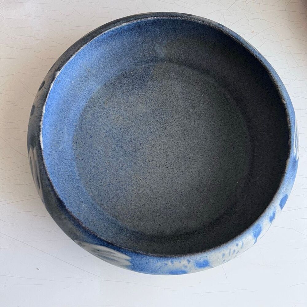 North Eagle Pottery hand-thrown and features a matte or glazed finish in blue an